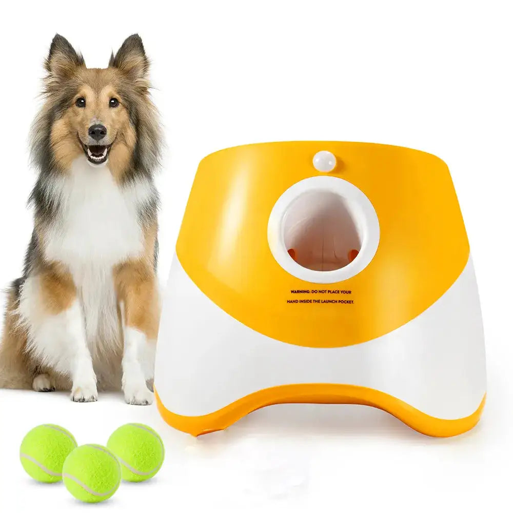Automatic Tennis Ball Launcher for dogs in yellow and white with three green tennis balls, ideal for solo pet play and training sessions.