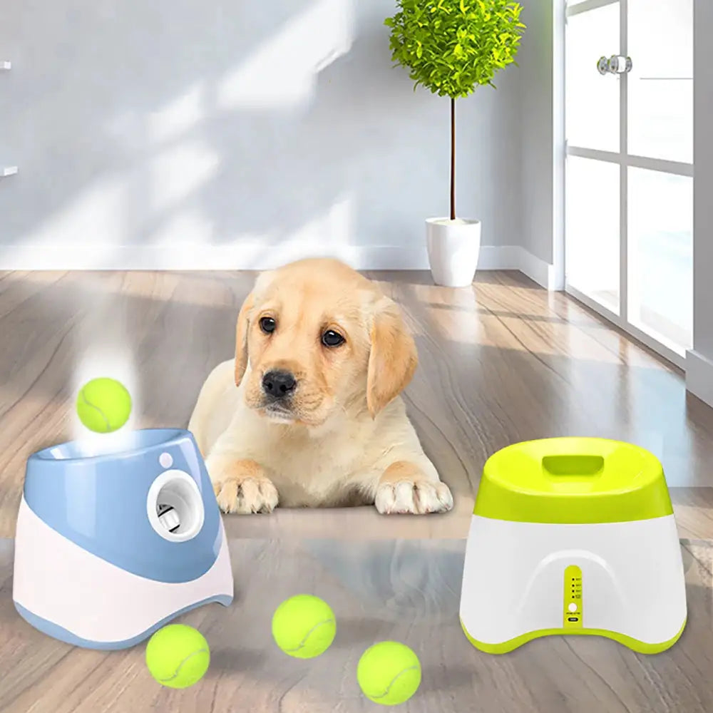 Automatic Tennis Ball Launcher for dogs shown with yellow tennis balls and a Labrador puppy indoors. Ideal for pet play and solo fetch training.